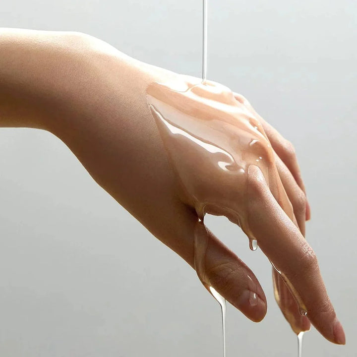 ANUA Heartleaf Pore Control Cleansing Oil in a 200 ml bottle, showcasing its sleek design and green oil texture.