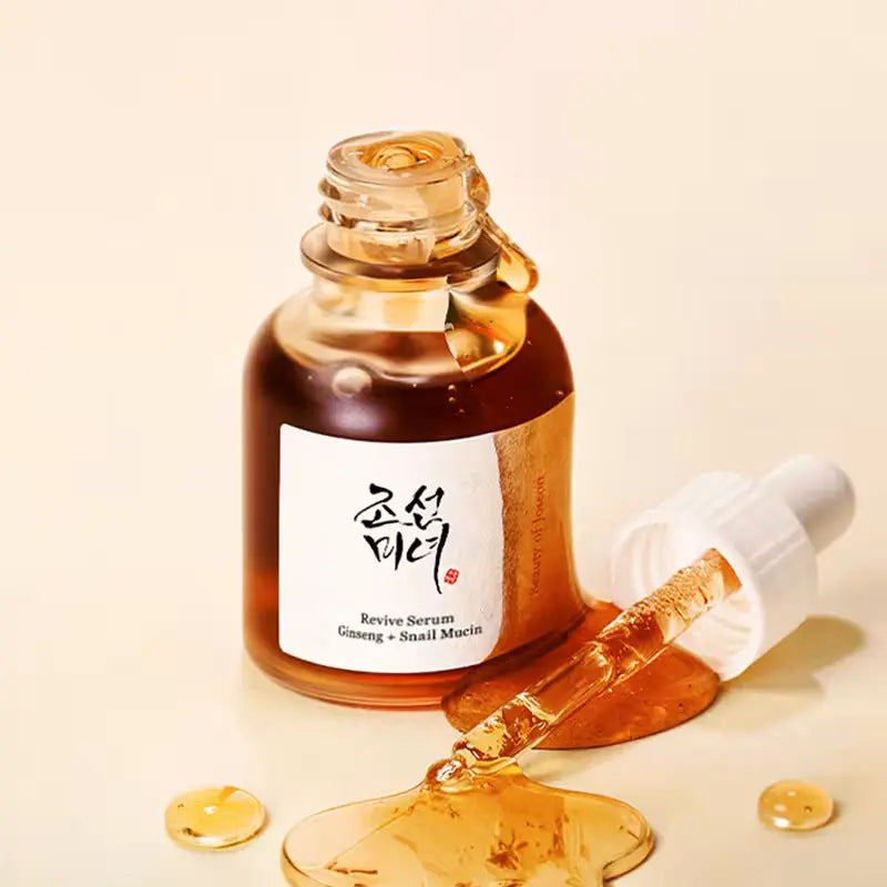 Beauty Of Joseon Revive Serum with ginseng and snail mucin in a 30ml bottle, showcasing the serum's clear, lightweight texture.