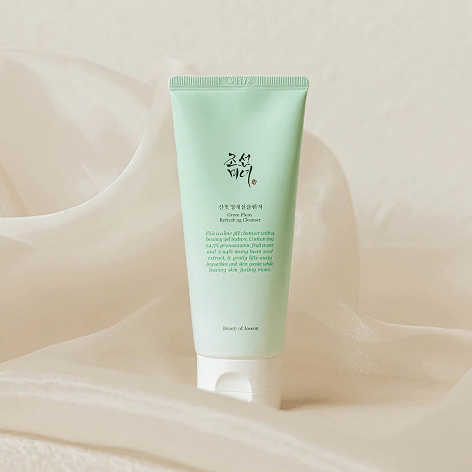 Nuaglow sensitive skin skincare routine with green plant-based cleanser in a clear bottle, suitable for gentle cleansing and hydration.