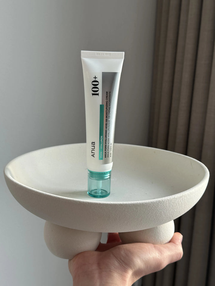 ANUA PDRN Hyaluronic Acid 100 Moisturizing Cream in a 60ml jar, featuring smooth, hydrating cream texture for facial skincare.