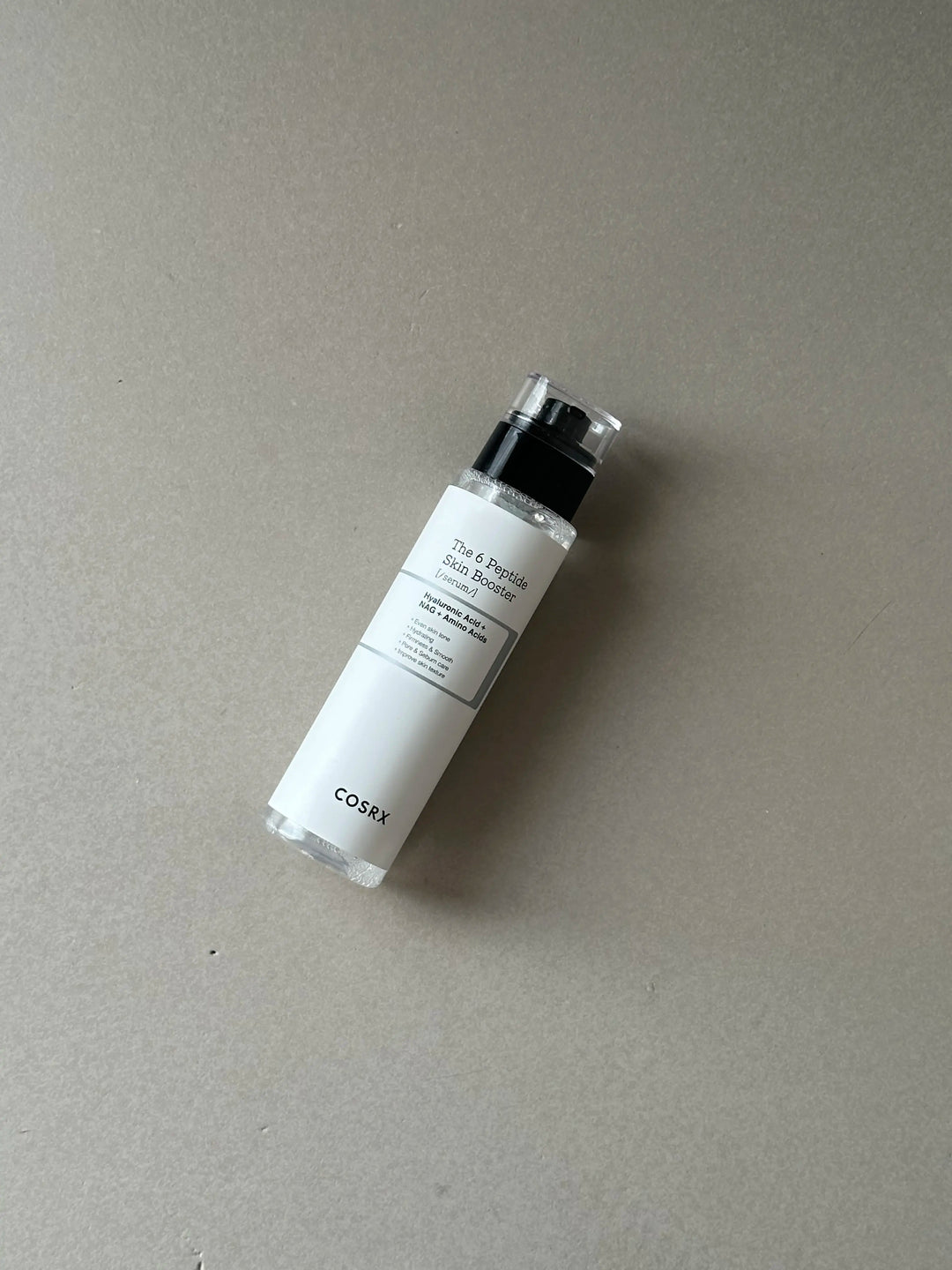 COSRX The 6 Peptide Skin Booster Serum toner bottle with pump dispenser, 150ml, showing the product label and packaging.