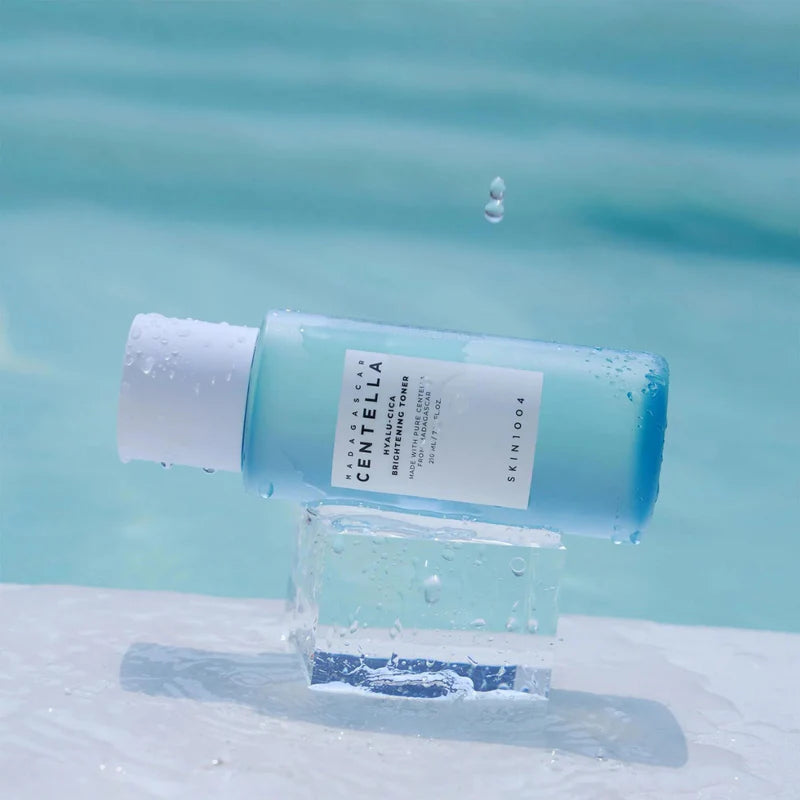SKIN1004 Hyalu-Cica Brightening Toner in a 210ml bottle, featuring clear liquid with a minimalist label, designed for skin hydration and brightening.