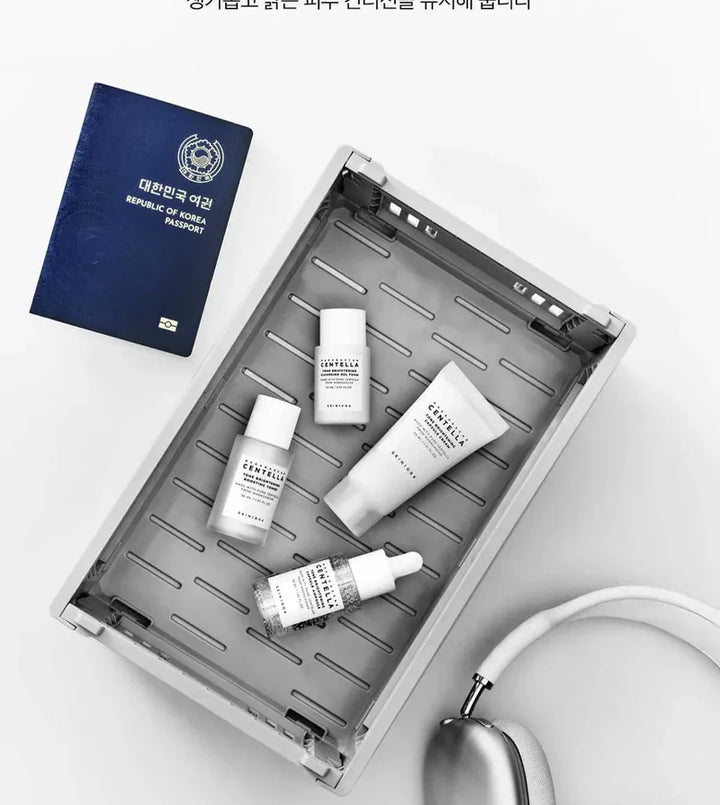 SKIN1004 Madagascar Centella Tone Brightening travel kit with small bottles and containers for skincare on the go.