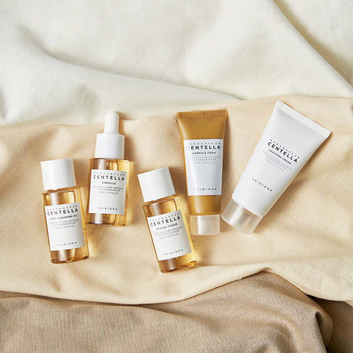 SKIN1004 Madagascar Centella travel kit with 170ml skincare bottles featuring natural ingredients and compact packaging for travel.